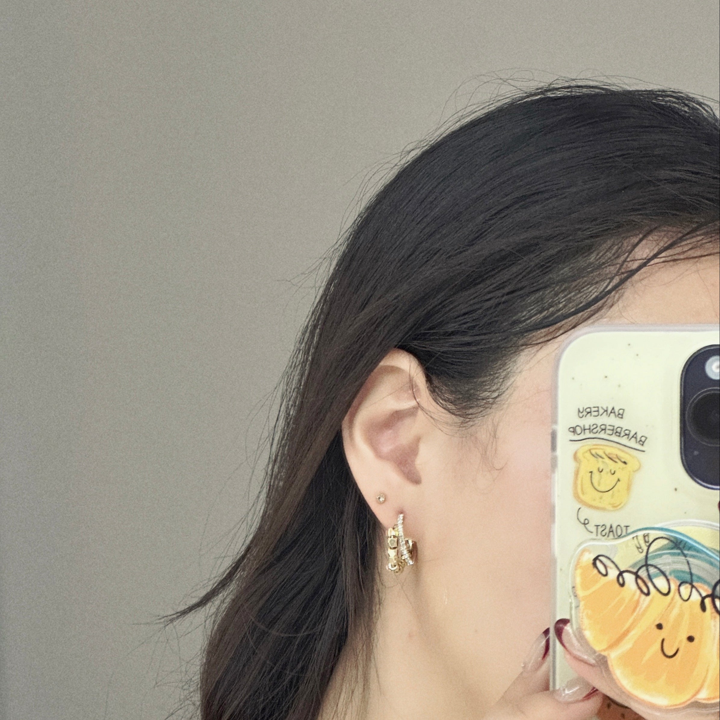 On-ear shot: double hoop gold earrings, nickel-safe