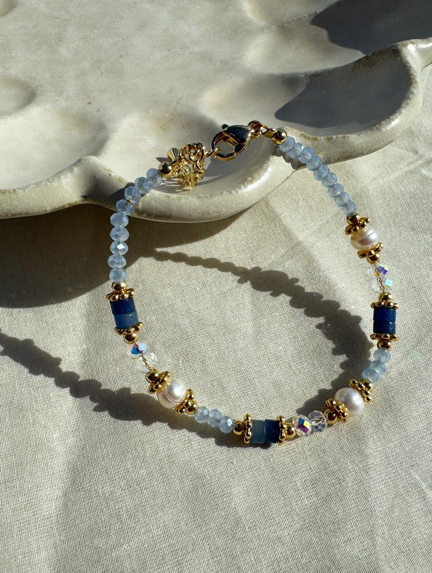 Aurora blue crystal necklace with pearl accents, 18K gold plated