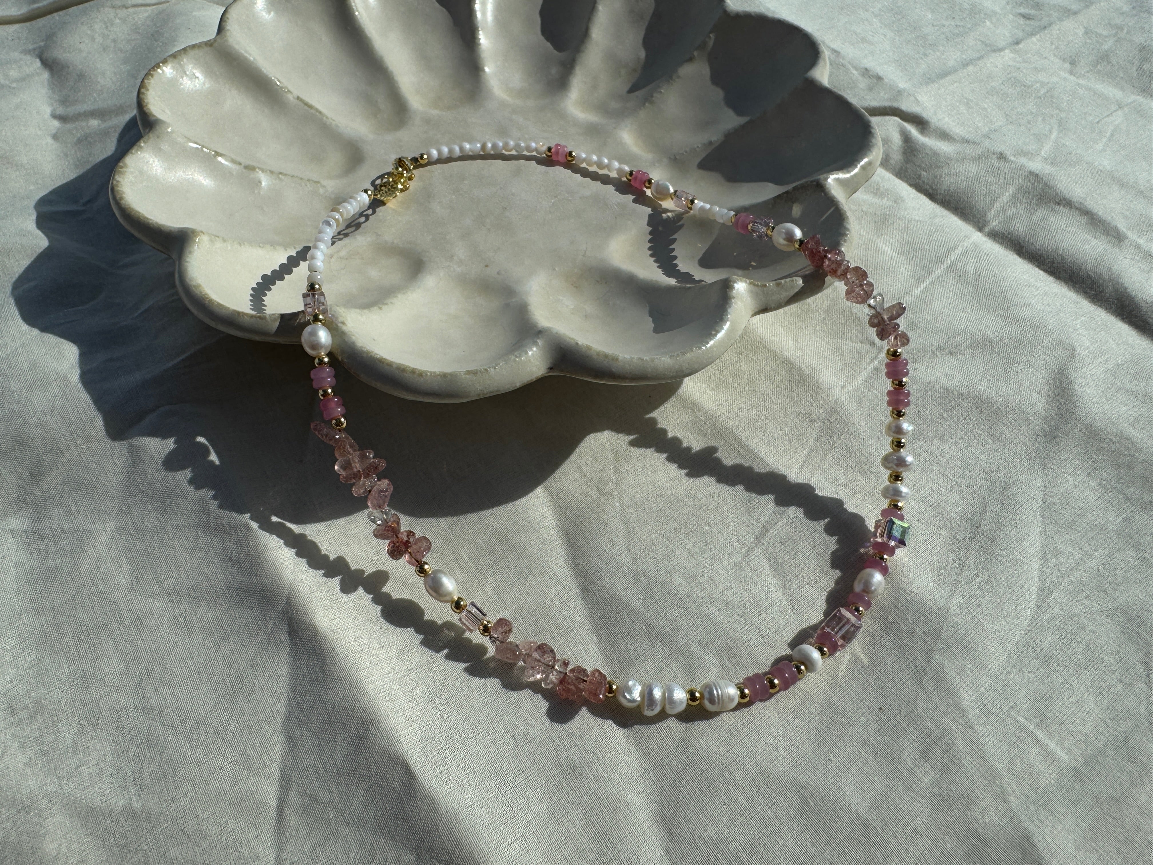 Berry Crush pink crystal necklace with pearl accents, 18K gold plated, layerable, adjustable close up