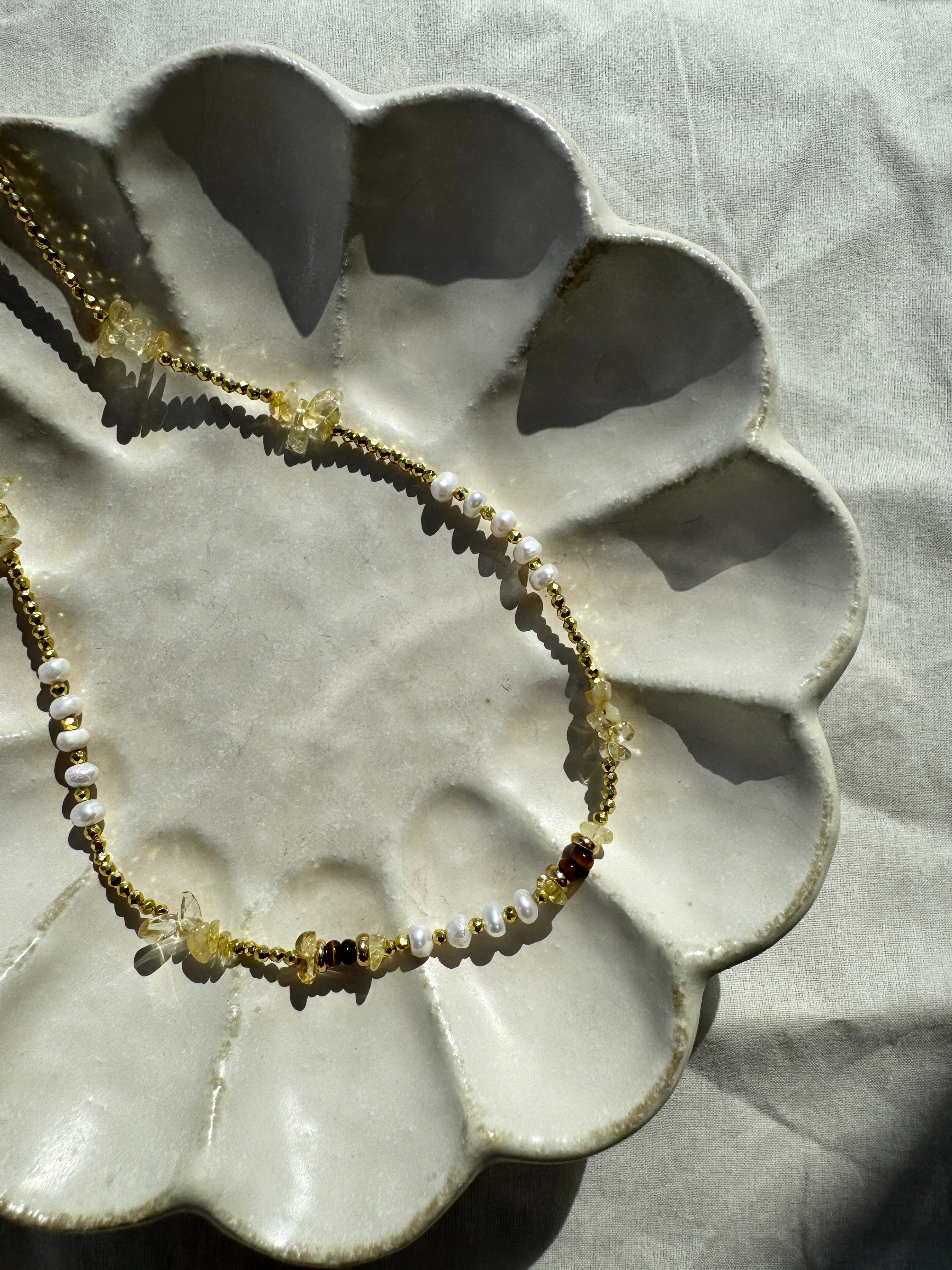 Champagne Pebble crystal necklace with pebble-cut beads, 18K gold plated accents, adjustable