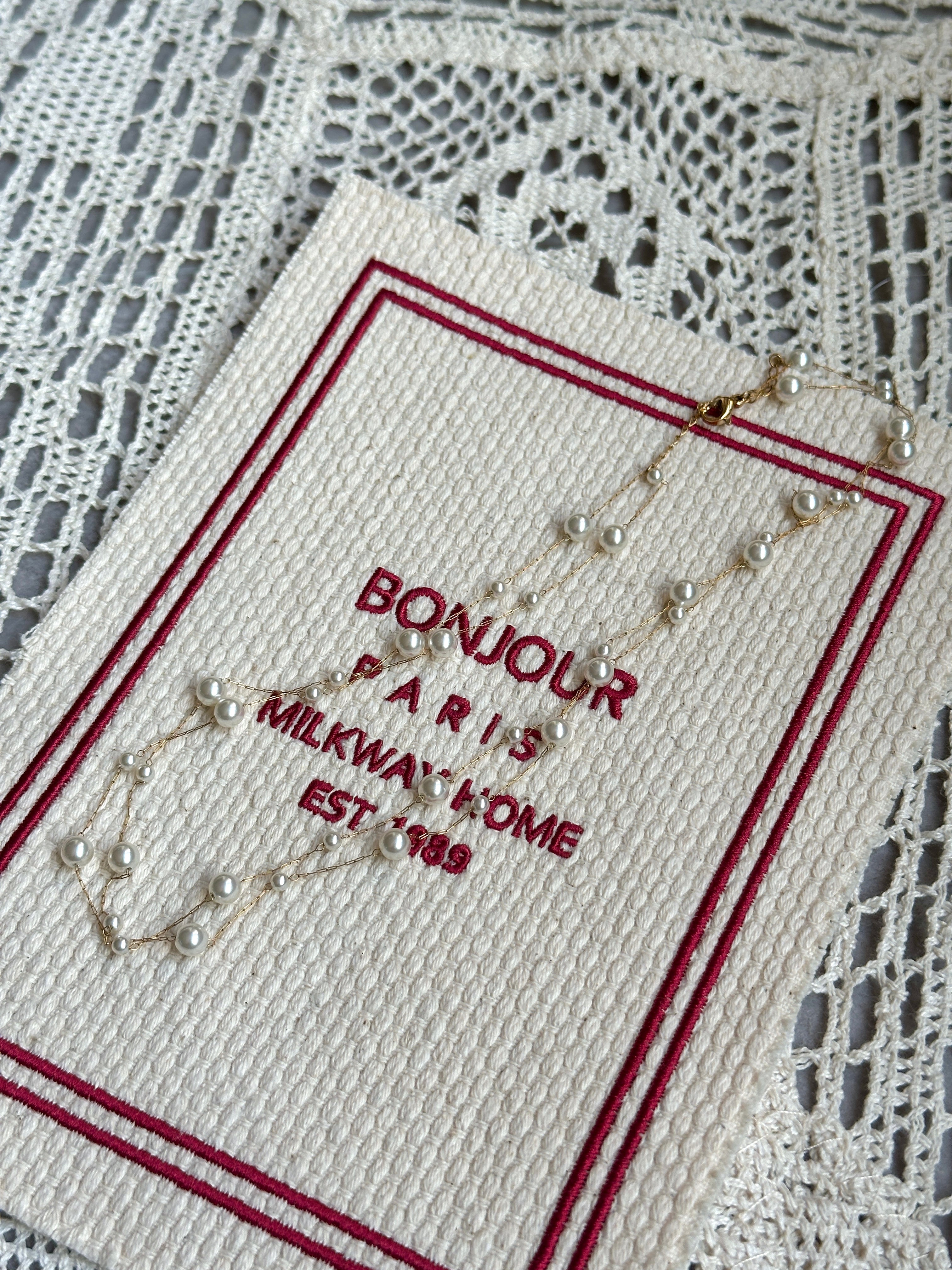 Pearl necklace with gold star accents, formal event ready