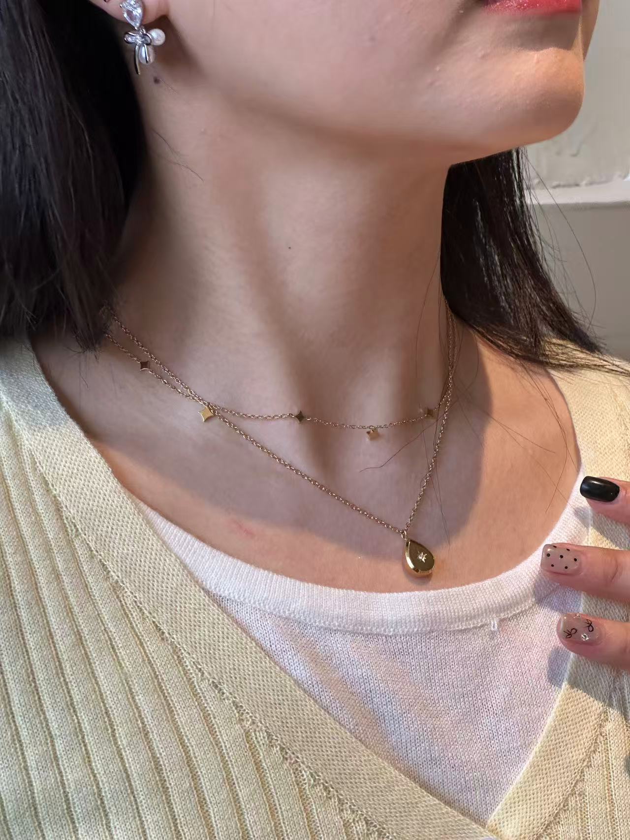 Star pendant stacked with a base chain, daily wear celestial jewelry