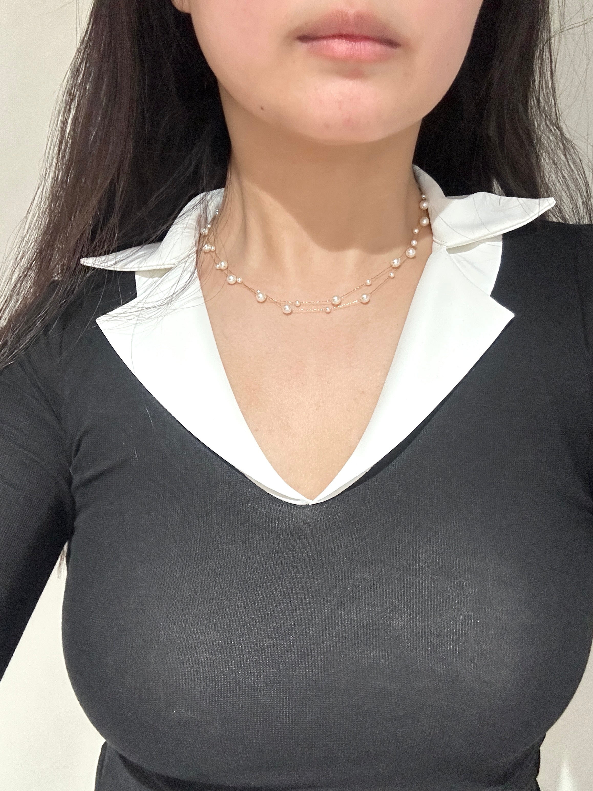 Pearl necklace with gold star accents, formal event ready close up