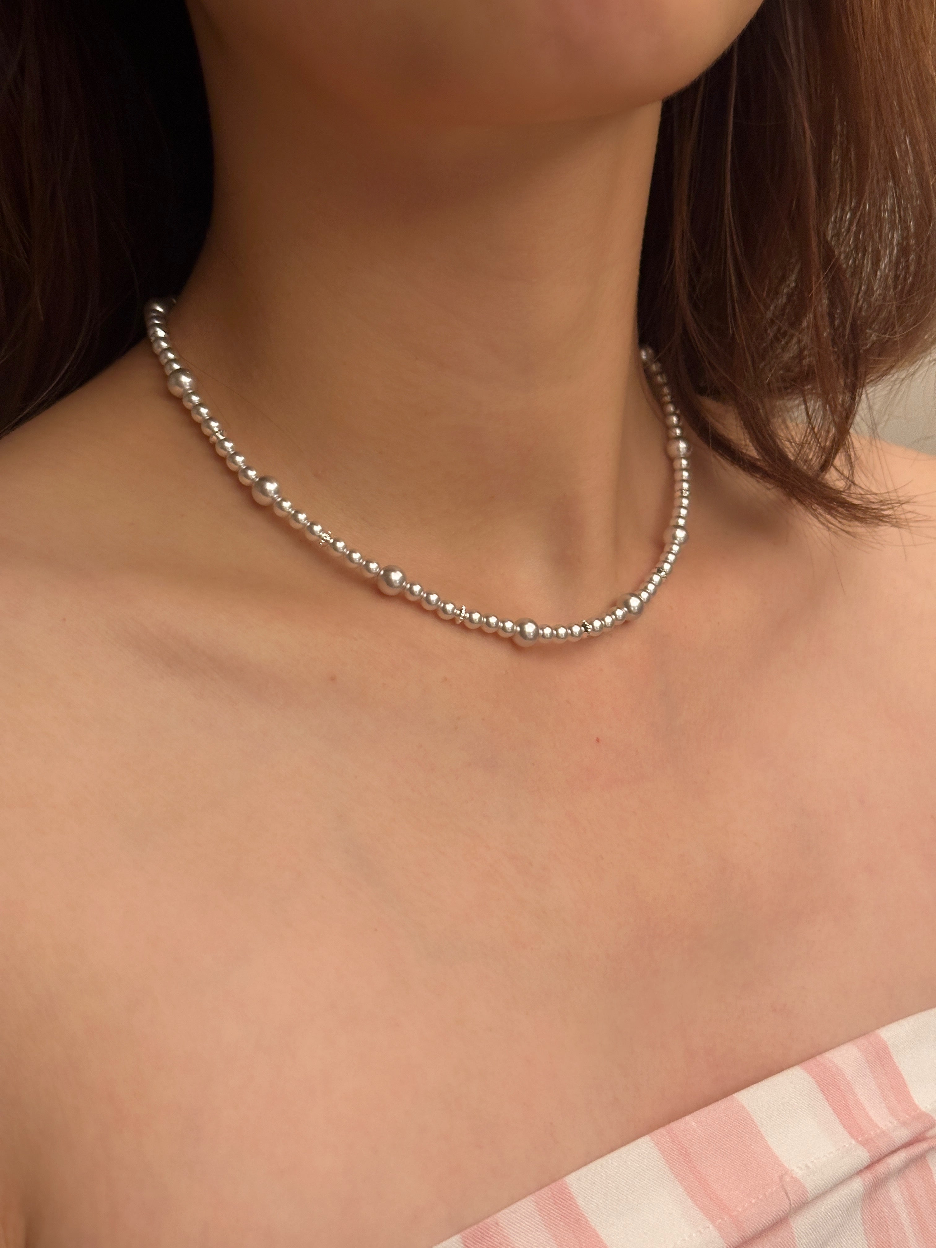 Minimalist pearl beaded necklace try-on